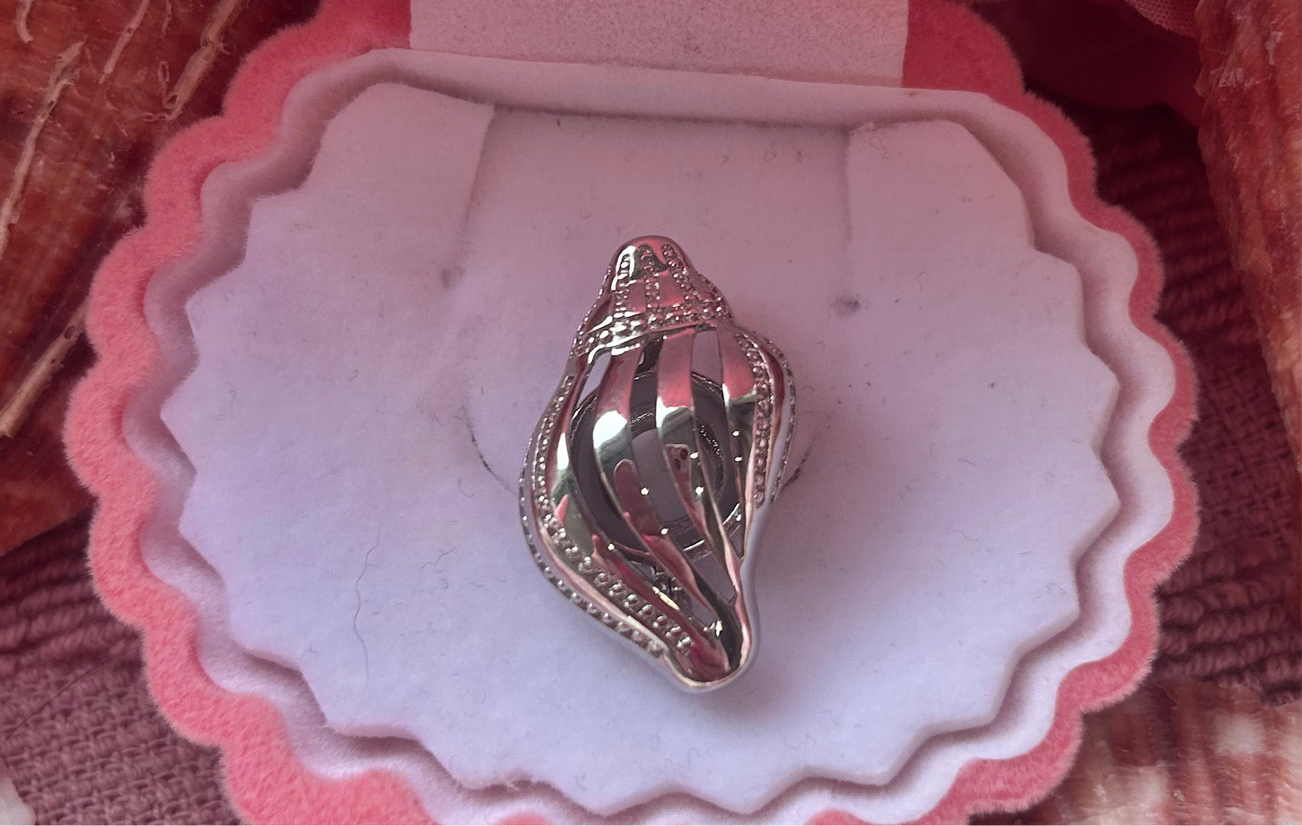 Silver plated conch shell cage pendant