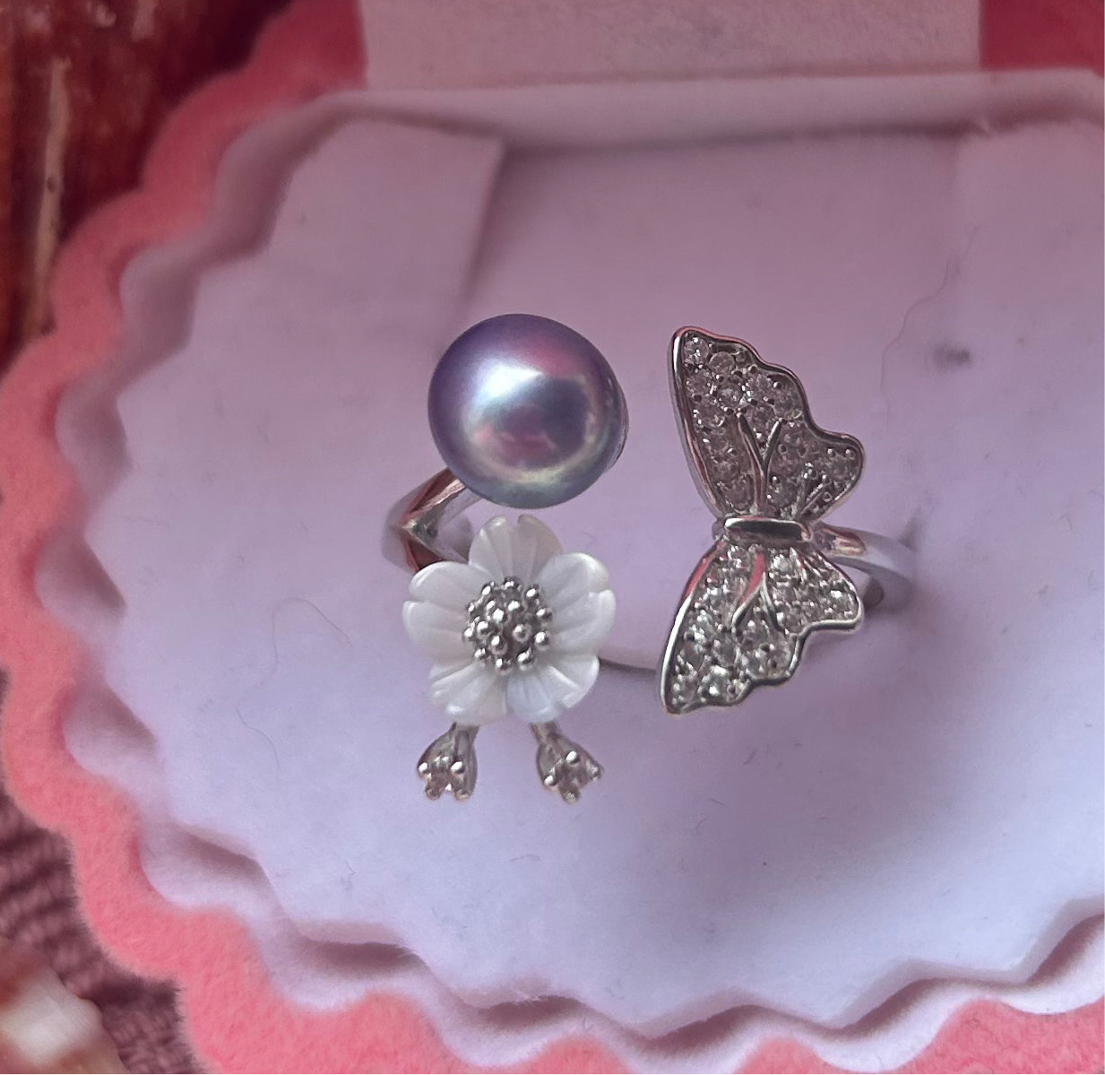 The Katie Ring. Sterling silver cubic zirconia butterfly with shell flower adjustable ring