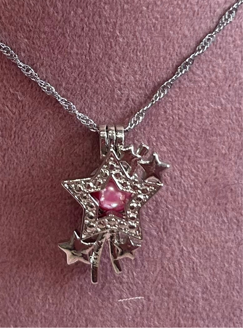 Shooting star silver plated cage pendant