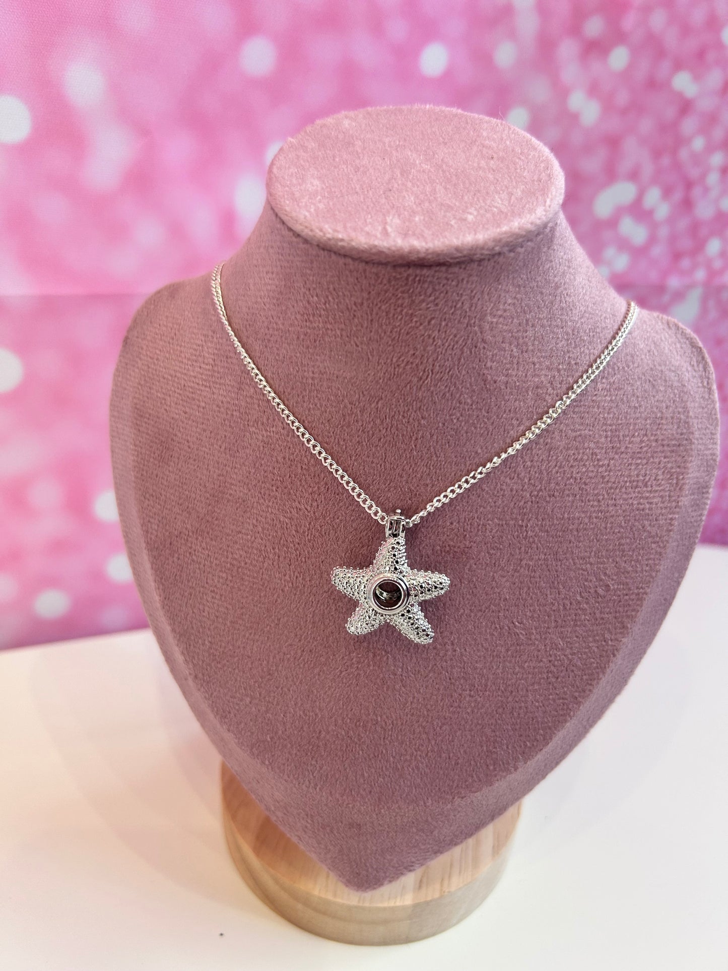Silver plated starfish cage pendant