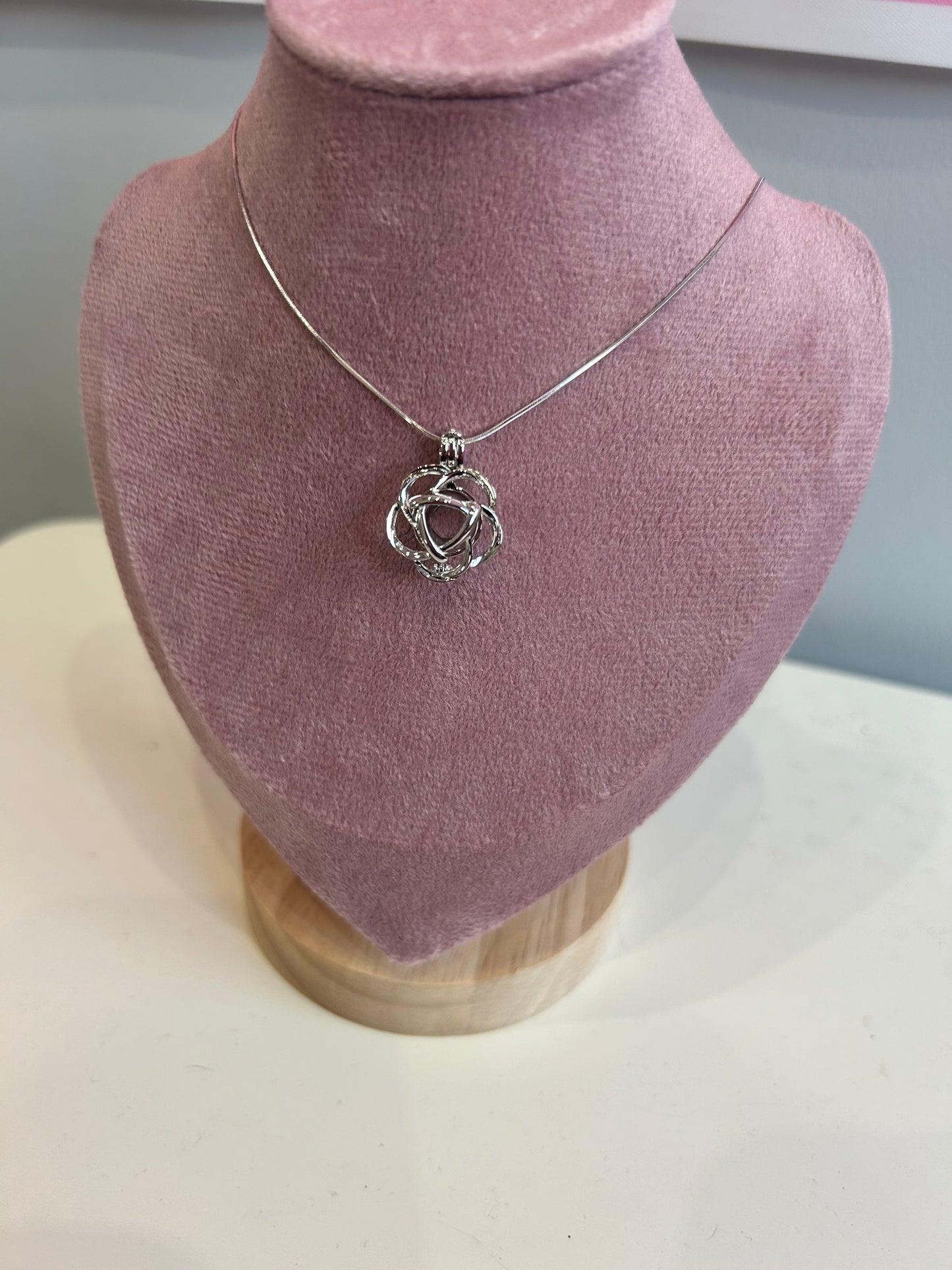 Silver plated round rose cage pendant