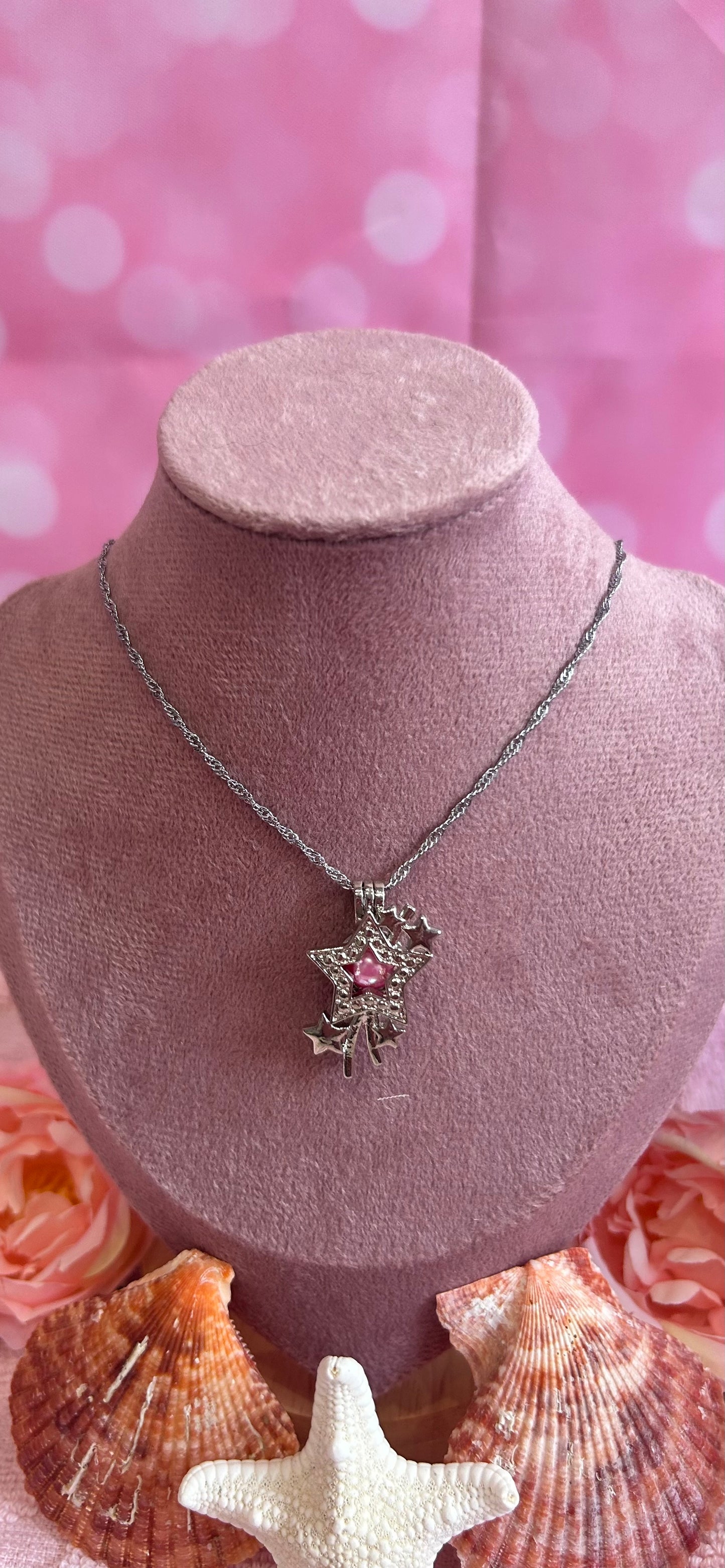 Shooting star silver plated cage pendant