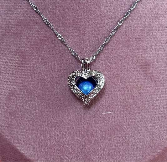 Silver plated open heart cage pendant
