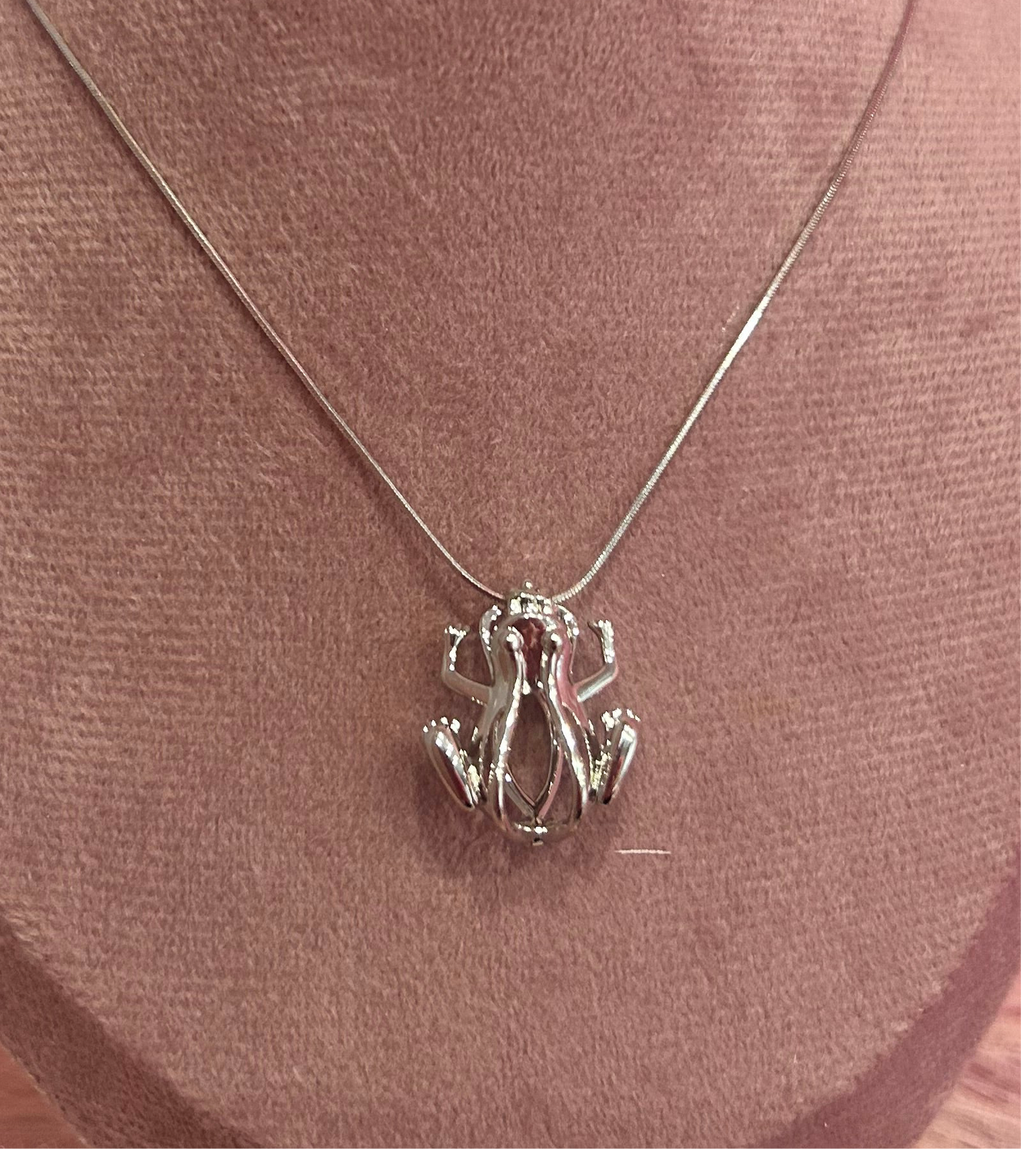 Silver plated frog cage pendant