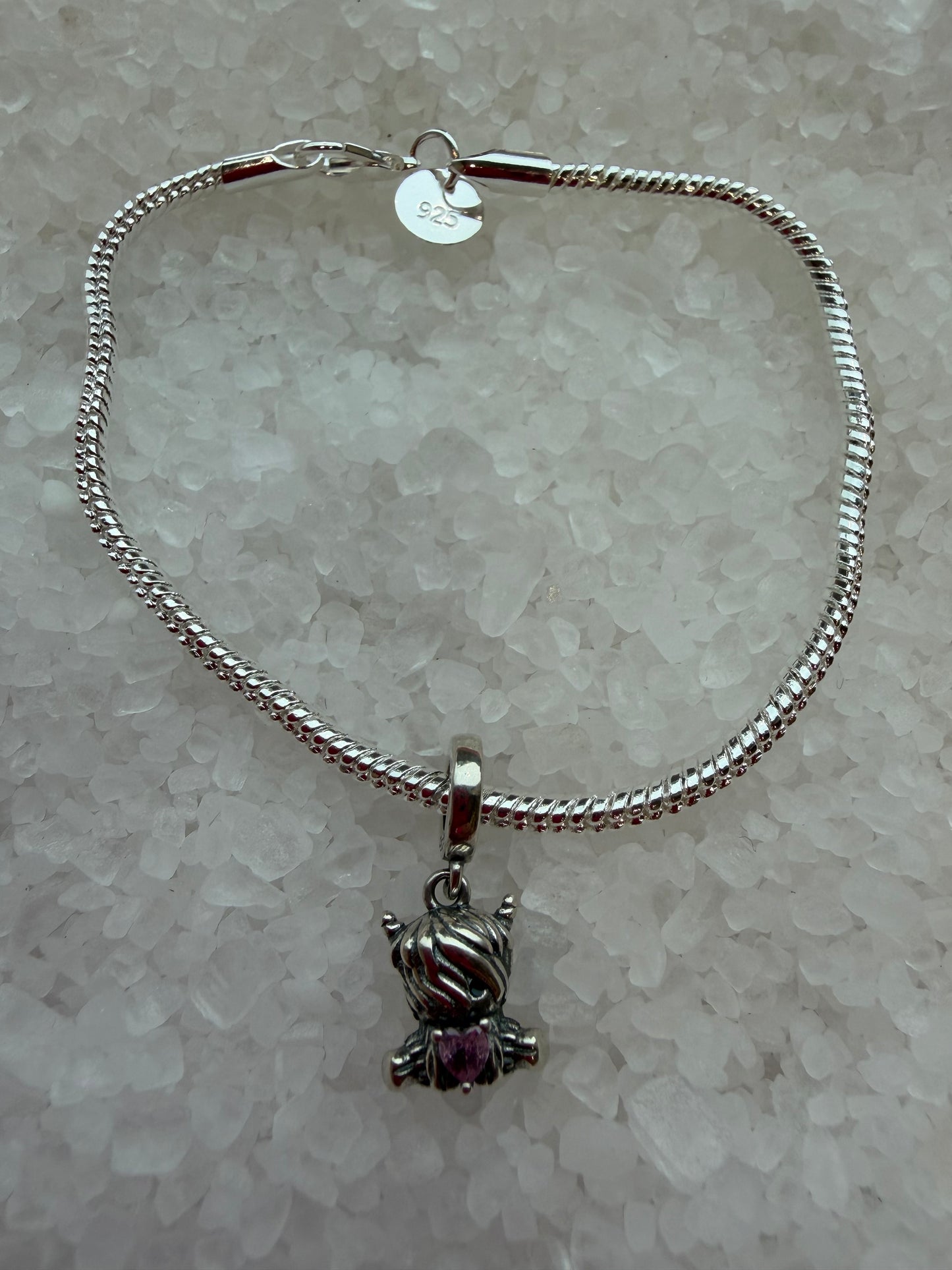 Silver plated cute highland cow with pink cubic zirconia