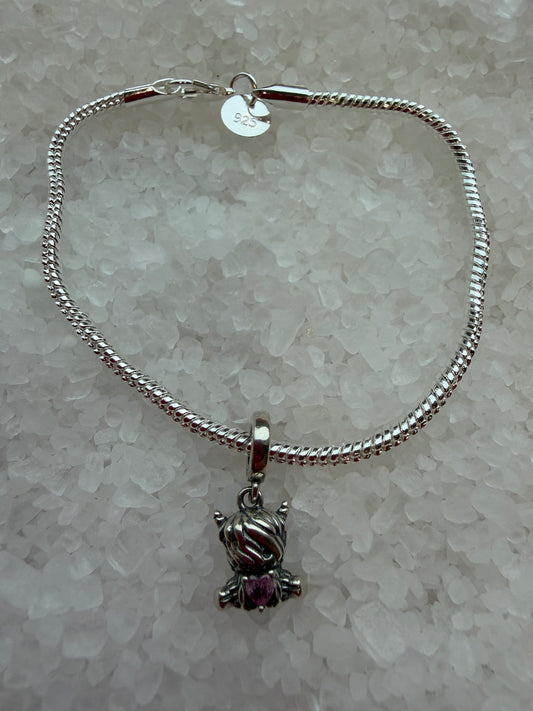 Silver plated cute highland cow with pink cubic zirconia