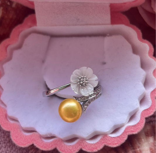 The Jenny Ring. Sterling silver with shell flower adjustable ring.