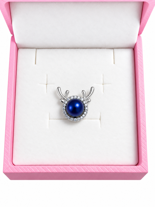 Silver plated reindeer pendant with Pepsi blue pearl