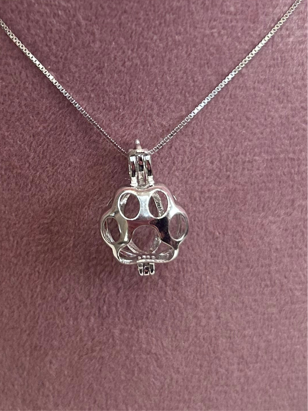 Sterling silver paw cage pendant