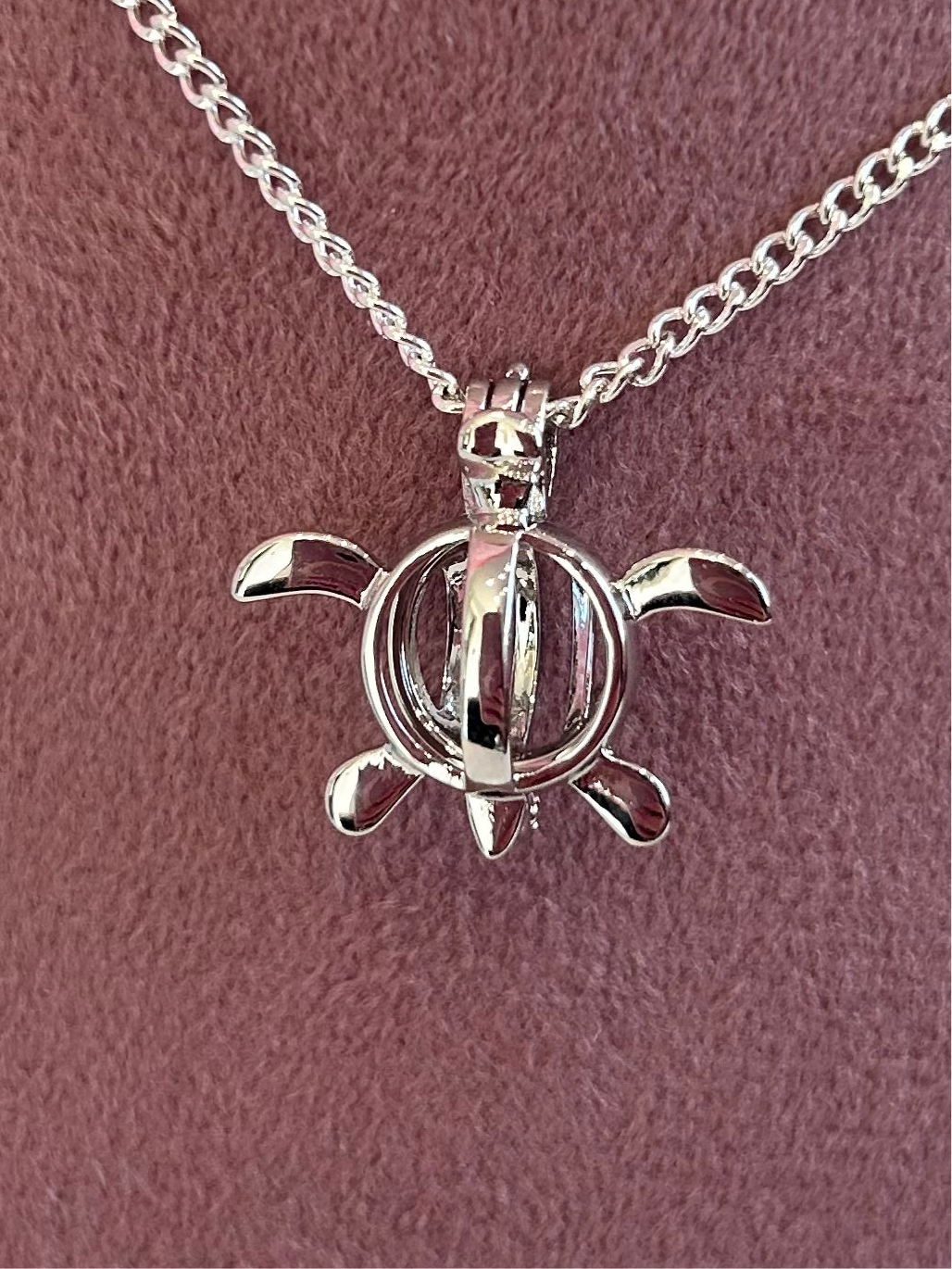 Silver plated turtle cage pendant