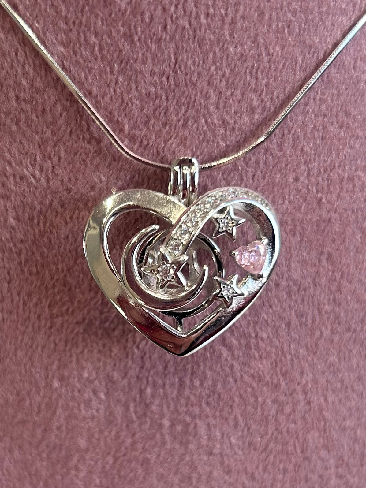 Sterling silver love heart moon and stars cage pendant with pink cubic zirconia