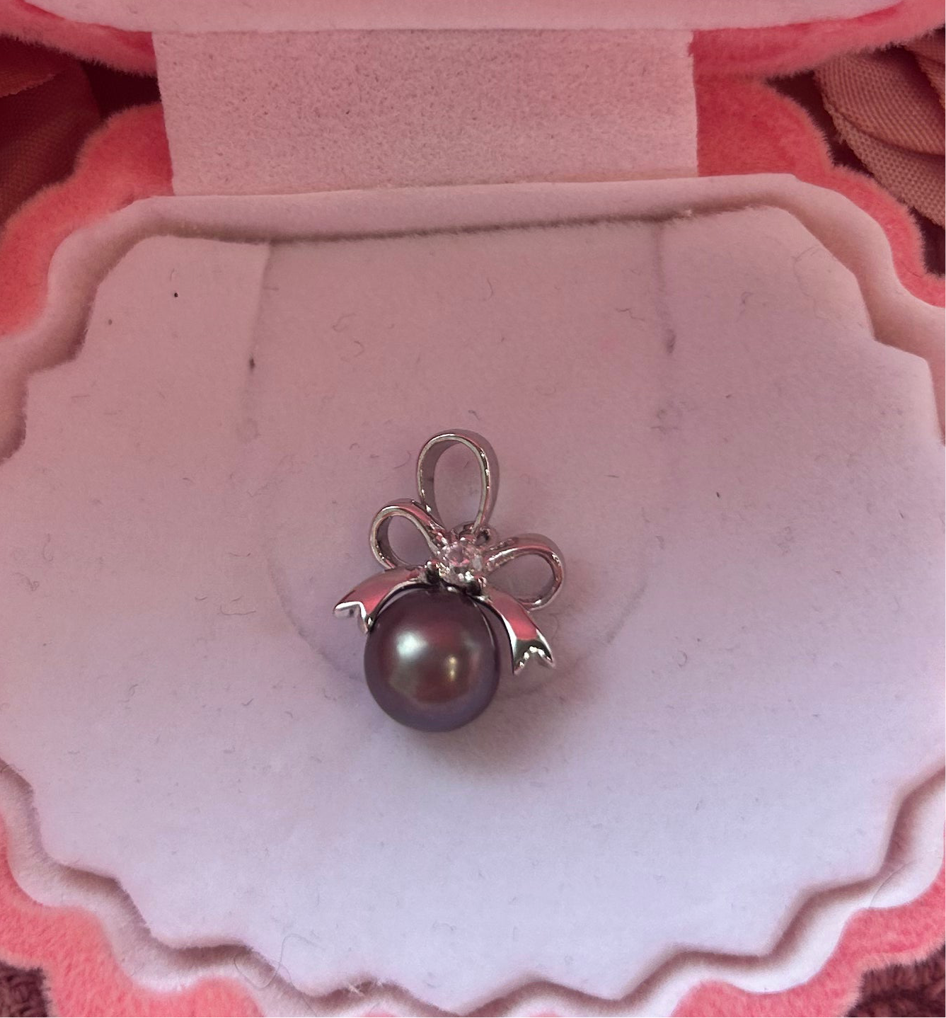 Sterling silver cubic zirconia bow drop pendant