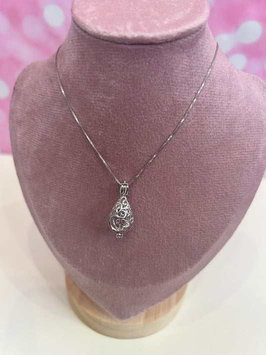 Sterling silver swirl drop cage pendant