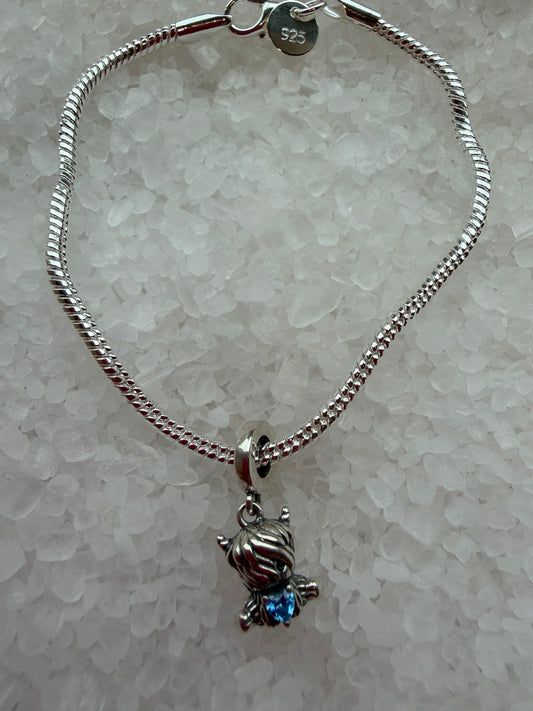 Silver plated cute highland cow bracelet with blue cubic zirconia