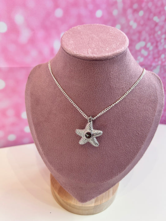 Silver plated starfish cage pendant