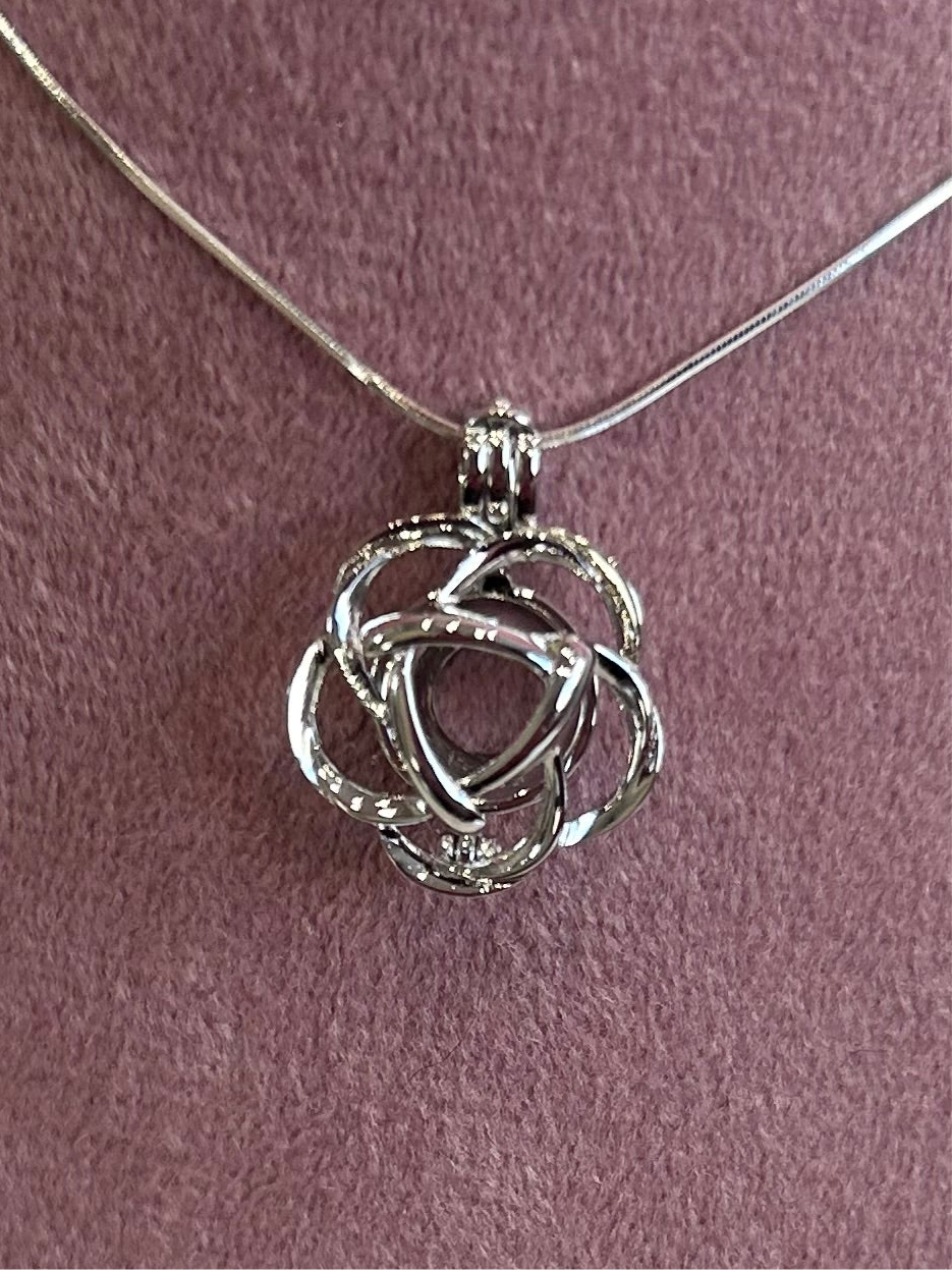 Silver plated round rose cage pendant