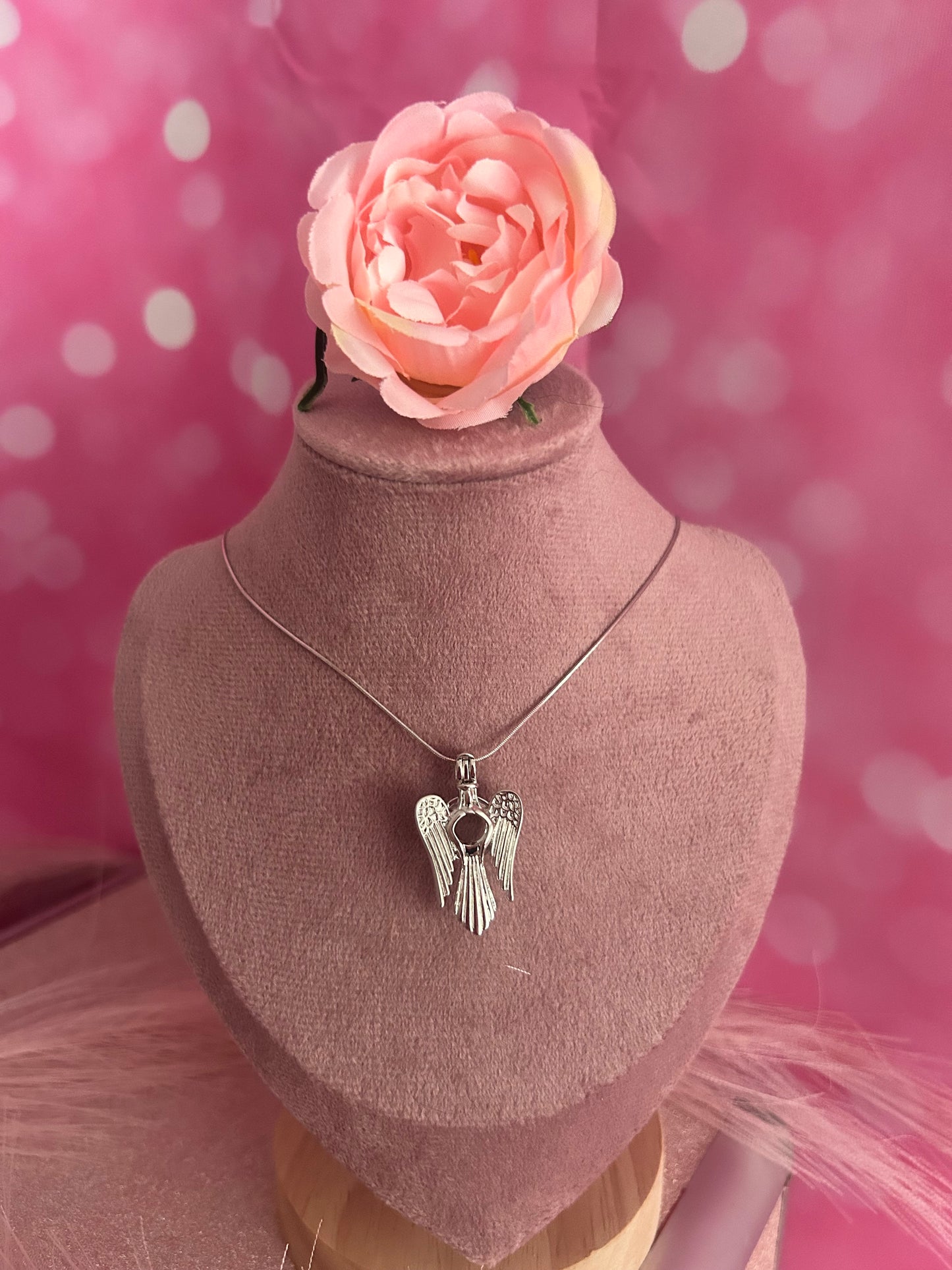 Silver plated angel wings cage pendant