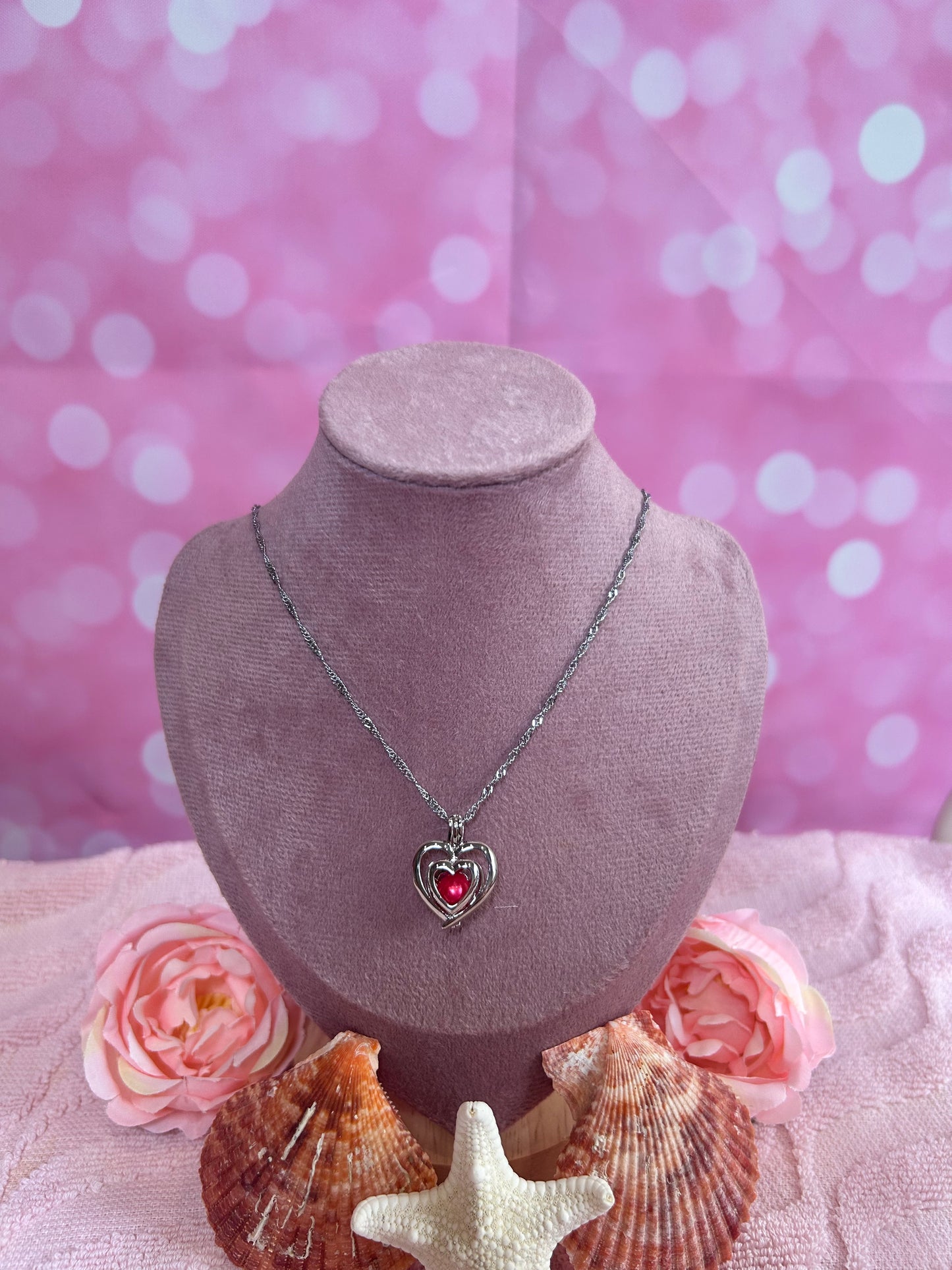 Silver plated double heart cage pendant