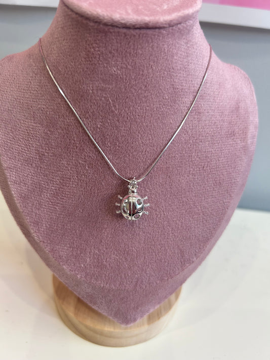 Sterling silver ladybug cage pendant