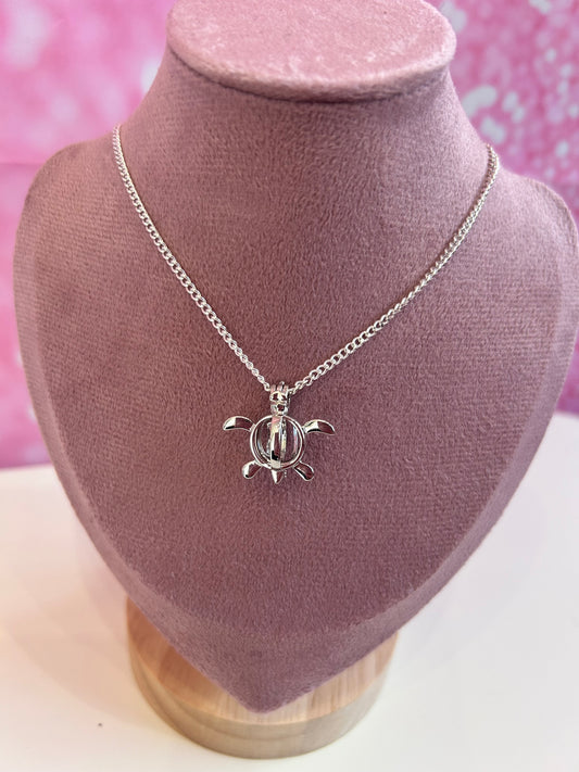 Silver plated turtle cage pendant
