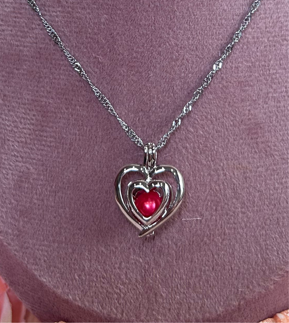 Silver plated double heart cage pendant