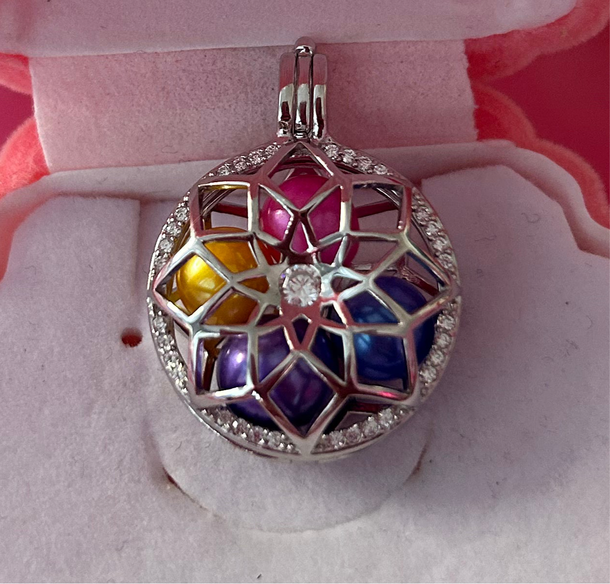 Sterling silver blooming flower cage pendant