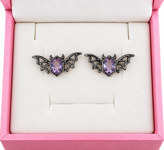 Black metal bat earrings with amethyst cubic zirconia
