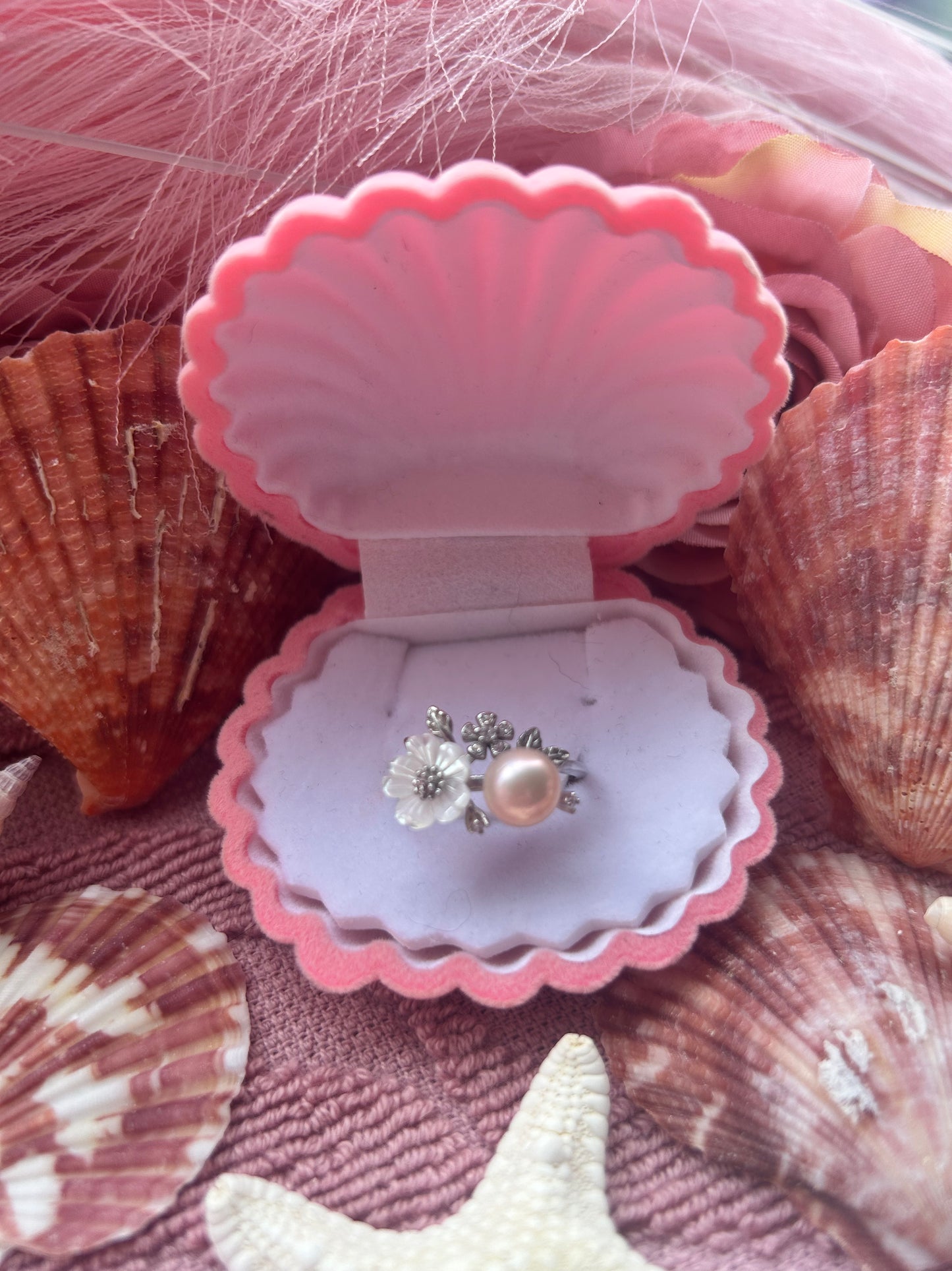 The Nancy Ring. Sterling silver with shell flower adjustable ring