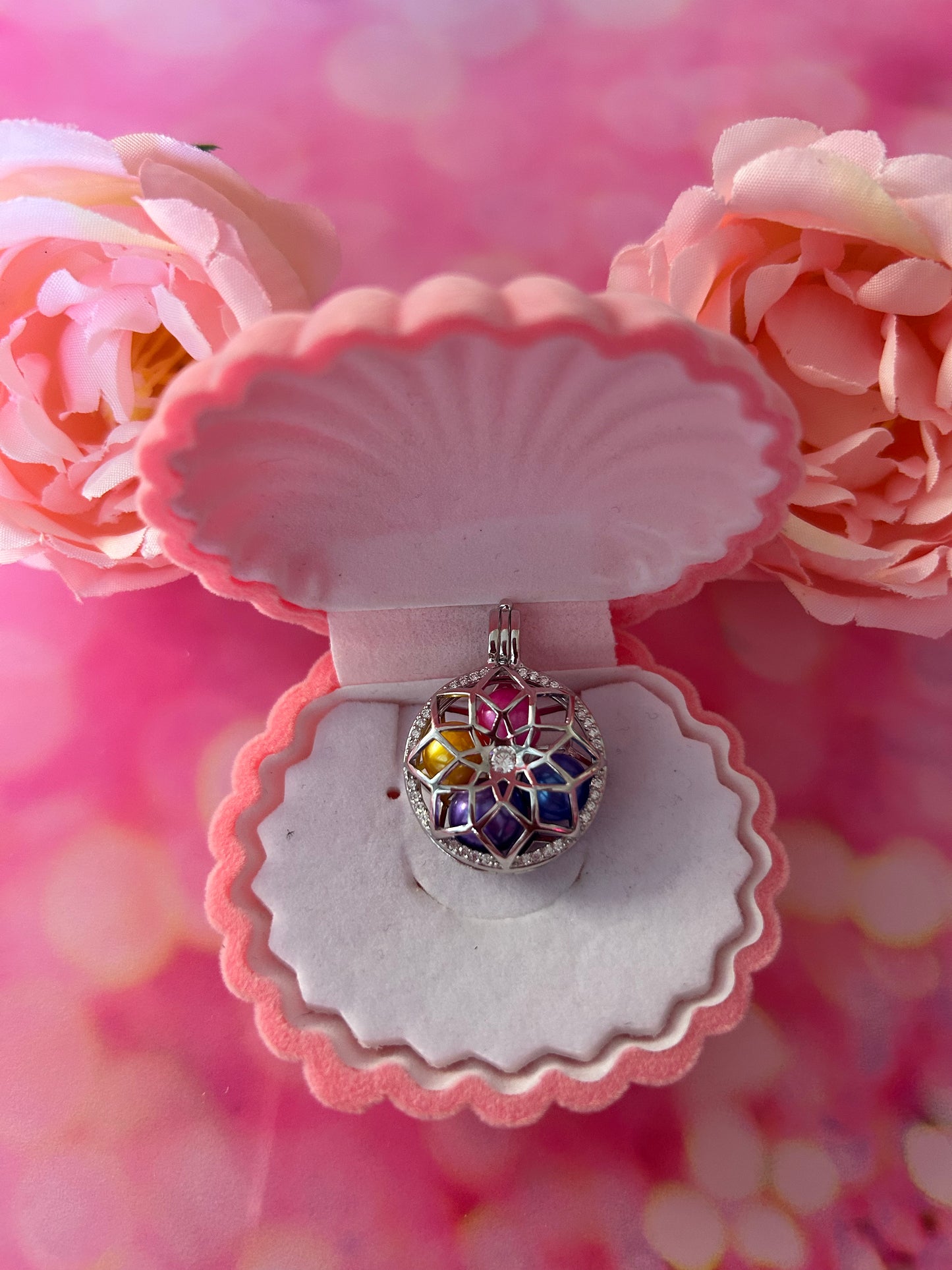 Sterling silver blooming flower cage pendant